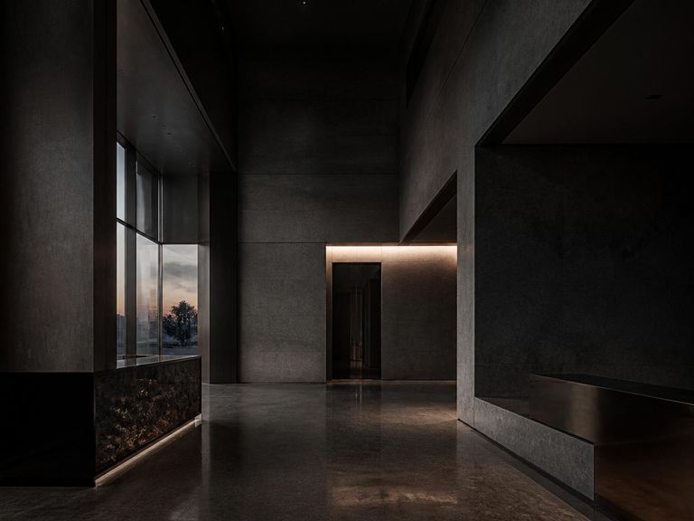 Hall de entrada de edifício corporativo em concreto e pedra ao entardecer